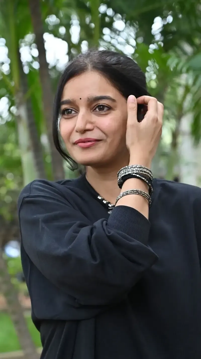 Actress Colors Swathi in Black Dress at Month Of Madhu Movie Press Meet